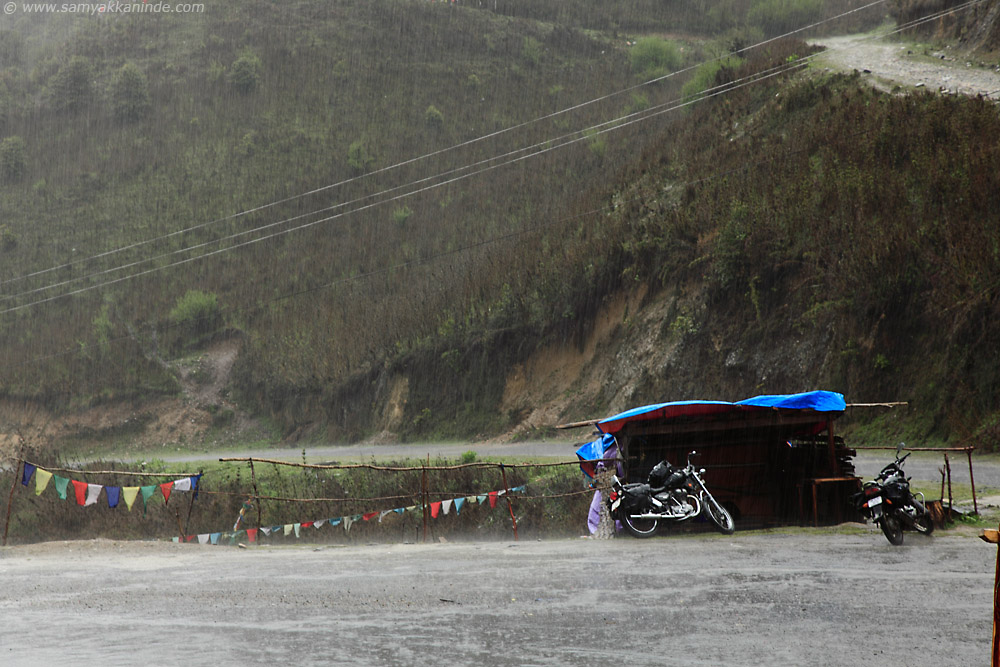 bikes in rain in pele la, bhutan