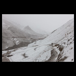 A Trekker walks in SnowStorm in Himalayas fine art prints India